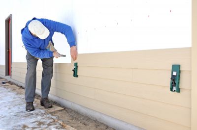Fiber Cement Siding Being Applied